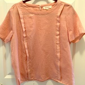 Pink blouse with embroidered details